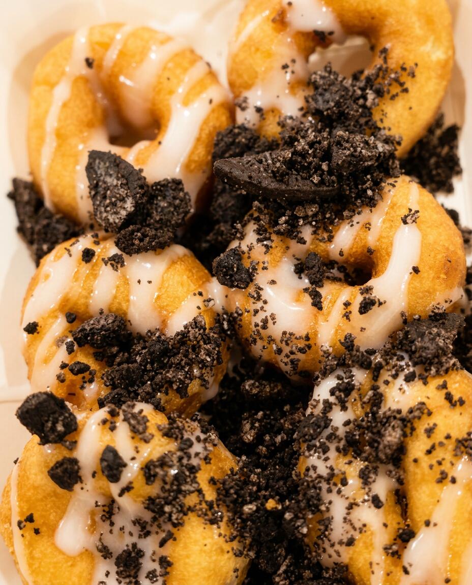 Close up of a warm cinnamon sugar mini doughnut