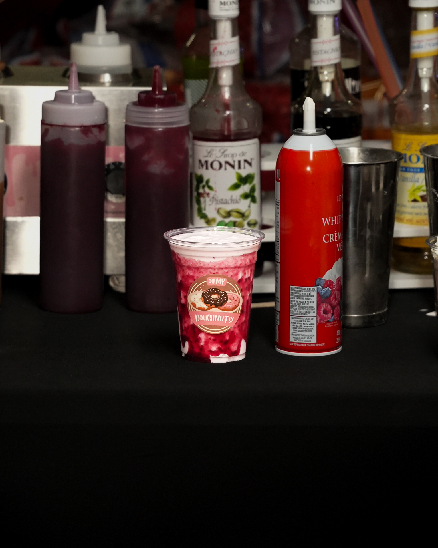 Berry topped mini doughnut cup served at a festival